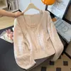 Suéter de tricô vazado estilo coreano para mulheres, novo modelo outono 2026, conjunto de duas peças com blusa de alça, capa de malha solta, top A13803