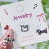 Nuevos Aretes de Dibujos Animados de Kt Oreja de Gato Hueso Uñas Lindos Goteo de Aceite Kawaii Aretes Acero de Titanio Modernos Elegantes
