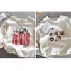 Camisetas de dibujos animados para niños y niñas, primavera y otoño 2026, nuevas camisetas básicas versátiles de algodón puro para niños, camisetas de manga larga con estampado elegante