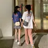Camisetas a juego para hermanas para mujer 2026 Nuevo estilo Manga corta Súper populares Holgadas de longitud media Cortas Atuendos para mejores amigas 911