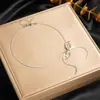 Elegante collar de corazón de doble capa, cadena de acero inoxidable chapada en oro de moda de nicho transfronterizo, cadena para la clavícula de lujo ligero para mujer