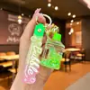Llavero creativo de dibujos animados luminoso con cabeza de Mickey y botella de arenas movedizas con líquido de aceite, cuentas de burbujas y botella de deriva