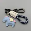 Llaveros de Dibujos Animados 'Hazte Rico' Llaveros Creativos para Llaves de Coche Anillo Cuerda Trenzada de Cuero Hecha a Mano Colgante para Mochila Regalo