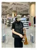 Chaleco de algodón de manga corta con sentido del diseño para mujer, tejido, hombros de punto empalmados, cuello alto, capa exterior, ropa para mujer, venta al por mayor offline, una pieza