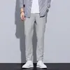 Otoño 2026 Nuevos Pantalones Casuales Elásticos en Cuatro Direcciones Pantalones para Hombre Pierna Recta Pequeña Versátiles Casuales Largos Juventud