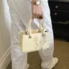 Bolsa de Ombro Casual Nova Moda Verão 2026 Transfronteiriça, Bolsa Transversal Estilosa e Atraente, Bolsa Quadrada Pequena Casual de Mão