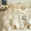 Juego de ropa de cama de cuatro piezas de terciopelo de leche con grabado ins sábana de tejido gofrado clase A funda de edredón de terciopelo coral faldón de cama textiles para el hogar juego de ropa de cama de tres piezas