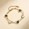 Pulsera exquisita de acero de titanio de 9 mm con trébol de cuatro hojas de doble capa para mujer, no se decolora, nueva moda de doble cara de lujo ligero, versátil y elegante
