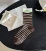 Otoño e Invierno Nuevo Bloque de Color Rayas Etiqueta de Tela Estilo Coreano Calcetines de Volantes hasta la Mitad de la Pantorrilla Venta al por Mayor Tendencia Original Ins Calcetines para Mujer