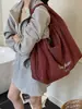 Bolsa de Lona Vermelha para Mulheres 2025 Nova Grande Capacidade Bolsa de Ombro Preguiçosa e Relaxada para o Dia a Dia Bolsa Tote para Estudantes Festas Viagens Tendência