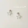 Pendientes de botón de estrella de cinco puntas con incrustaciones de diamante de plata de ley S925 Ou Ni Han para mujer Moda de alta gama Estilo Ins Tachuelas de hueso de oreja de estrella de circón