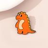 Nuevo y lindo broche de dinosaurio de dibujos animados, suave y adorable, de metal con forma de gota de aceite, para bolso de estudiante, insignia decorativa, disponible al por mayor.