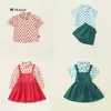 Ropa para Niños Jila Traje de Falda con Tirantes para Niñas 2025 Otoño Nuevo Estilo Coreano para Niños Camisa Roja de Lunares Conjunto de Dos Piezas