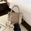 Bolso de Cubo Portátil Exquisito Versátil Estilo Coreano para Mujer 2026 Nuevo Simple Personalidad Casual Bolso de Hombro Cruzado