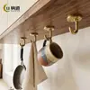 Ganchos metálicos creativos transfronterizos para detrás de la puerta en la entrada o el dormitorio, almacenamiento decorativo de abrigos y sombreros montado en la pared, ganchos de latón para abrigos montados en la pared del baño
