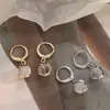 Pendientes de piedra ojo de gato de diseño original pendientes cortos de estrella de diseño nicho pendientes de temperamento de moda socialité clip para la oreja