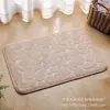 Alfombra de piso con relieve de guijarros de vellón de coral para puerta de baño alfombrilla absorbente para pies empaque personalizado fábrica de origen al por mayor