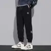 Pantalones de chándal de pana para hombre, temporada Primavera/Otoño 2026, versátiles, de corte holgado, estilo coreano, modernos, casuales, largos, estilo harén