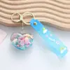 Llavero creativo de arenas movedizas de aceite encantador moda moderna colgante pequeño exquisito lindo regalo para pareja mayoreo