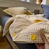 Conjunto de cuatro piezas de jacquard lavado estilo minimalista con botones, sábana bajera y funda nórdica de algodón lavado, juego de tres piezas de sábana bajera ajustada para dormitorio de estudiante 4