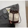 Bolso Único de Bloques de Color para Mujer 2026 Nueva Moda Versátil Bolso Cruzado Retro para Viajar al Trabajo Bolso Cubo de Hombro Moderno