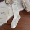 Nuevos calcetines de lana estilo coreano para mujer, calcetines de media pantorrilla, engrosados para otoño e invierno, tejidos y cálidos, calcetines holgados para mujer