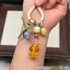 Cera de Abeja de Segunda Generación Varios Estilos Oso Bolsa de Queso Colgante Llavero DIY Exquisito Adorno de Joyería