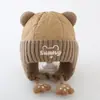 Bonitos y adorables gorros de otoño e invierno para niños, con diseño de poner, material de punto y una serie de dibujos animados, que brindan abrigo y protección para los oídos para bebés y niños pequeños.