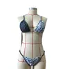 Conjunto de biquíni listrado zebra color block estilo europeu e americano para mulheres em 2026, com design transfronteiriço, decote halter sexy e detalhes de fivela de strass
