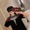 Fornecimento transfronteiriço atacado INS Europa e Estados Unidos marca da moda MB manga curta masculina e feminina cores de amantes asas de pena clássica T-shirt de meia manga