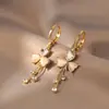 Pendientes de Trébol de Lujo Ligero 2026 Nuevo Modelo Nicho Gama Alta Borla Pinzas para Orejas Galvanizadas para Mujer Otoño e Invierno Pendientes Elegantes