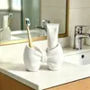 Soporte para cepillos de dientes con forma de lazo Sin instalación Plástico Soporte de almacenamiento Baño Dormitorio Tipo bolígrafo Soporte de exhibición para cepillos de dientes