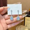 Nuevos pendientes de botón translúcidos con forma de huevo estilo chino, lujo ligero vintage, diseño único, pendientes de moda y sofisticados