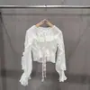 Blusa transparente de volantes de alta gama europea y americana para mujer, nuevo top cruzado con cuello en V para venta transfronteriza, falda corta de lentejuelas