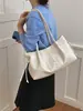 Outono 2026 Nova Bolsa Tote Retrô de Lona com Letras Grande Capacidade Ombro Único Portátil de Axila Bolsa Atacado Bolsas Femininas