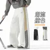 Pantalones de chándal a rayas personalizados/estilo americano, nueva colección de otoño, corte holgado, efecto de caída, bordado en bloques de color, versátiles para deportes y uso casual