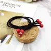 Corea del Sur nuevo tocado accesorios para el cabello corbata liga para el pelo banda para el pelo con diamante pequeñas cuentas de color rojo cereza cubierta de cuero tienda de 2 yuanes