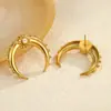 Europa y Estados Unidos populares transfronterizos simples aretes de cuerno de luna acero inoxidable chapado en oro de 18 quilates aretes alto sentido de diseño venta al por mayor