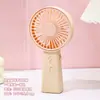 Mini ventilador de mano ventilador de escritorio pequeño color caramelo vertical tres vientos recargable por USB ventilador eléctrico portátil venta al por mayor