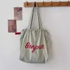 Bolso de Hombro Canvas Cultural y Creativo para Universidad Personalizado Nuevo Gran Capacidad Casual Versátil Cordón Estampado Bolso de Mano