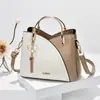 Bolso de mujer Taizhou 2024 nueva tendencia portátil coreano color de contraste gran capacidad moda hombro bandolera una generación de pelo