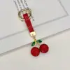 Artículo Popular Transfronterizo: Llavero de Cerámica Arcilla Cereza con Pedrería, Colgante para Llave de Coche, Dijes Brillantes de Cereza con Pedrería para Bolso, Llavero