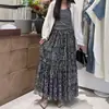 Saia casual boêmia com estampa vintage de outono para mulheres, saia longa com cintura elástica, roupa feminina versátil, saia com barra ampla e fluida