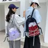 Mochila minimalista transfronteiriça novo modelo 2026 para estudantes universitárias, mochila para esportes ao ar livre, bolsa de trilha, bolsa para viagens de curta duração