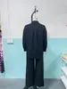 Conjunto de dos piezas para mujer de Amazon transfronterizo europeo y americano, cárdigan de color liso con botones, manga larga, pantalones de pierna ancha, traje casual de primavera y otoño, nuevo