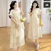 Vestido de Maternidade Tencel Lyocell Cor Creme Novo Estilo Verão 2026 Vestido Longo Irregular com Babados Linha A