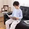 Camiseta infantil raglan de manga comprida estampada 2026 novo estilo outono meninos cor sólida solta base para crianças mais velhas