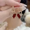Pendientes de circonita con forma de estrella y perla de moda para mujer, diseño de nicho, pendientes de lujo ligeros de alta gama, elegantes pendientes de celebridades que combinan con todo.