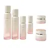 Set de botellas de vidrio de alta gama con degradado rosa 30ml/100ml empaque cosmético para productos de cuidado de la piel para damas