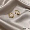 Aretes de Aro Pequeños Círculos Plateados Dorados para Mujer 2026 Nuevo Estilo Caliente Lujo Ligero Temperamento Toque de Alta Gama Cierres de Arete Exquisitos Accesorios para Aretes